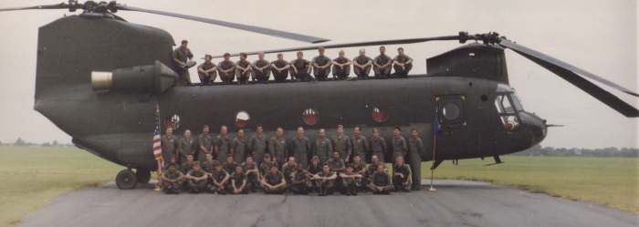 Fall 1987: Boeing CH-47D Chinook 86-01648 during what is believed to have been a unit change of command ceremony. In the photograph is SPC Mitch Finley, crew chief on 86-01648 up through March 1988. He is on the top of the bird, 5th from left side of photo. Other personnel in the picture are as yet unknown.